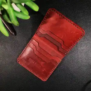 Red leather vertical smart wallet with card slots from Ridge N Threads Pakistan.